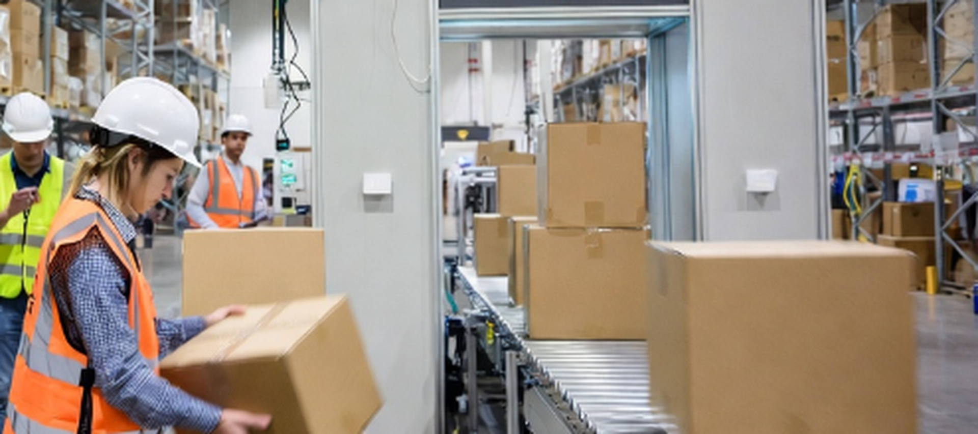 Warehouse staff performing manual cycle counts compared to automated RFID portal systems reducing labor costs Warehouse staff performing manual cycle counts compared to automated RFID portal systems reducing labor costs